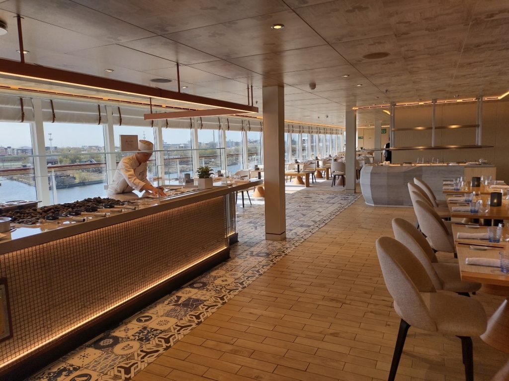 A chef preparing food at the World Café, photo by Jenna Buege